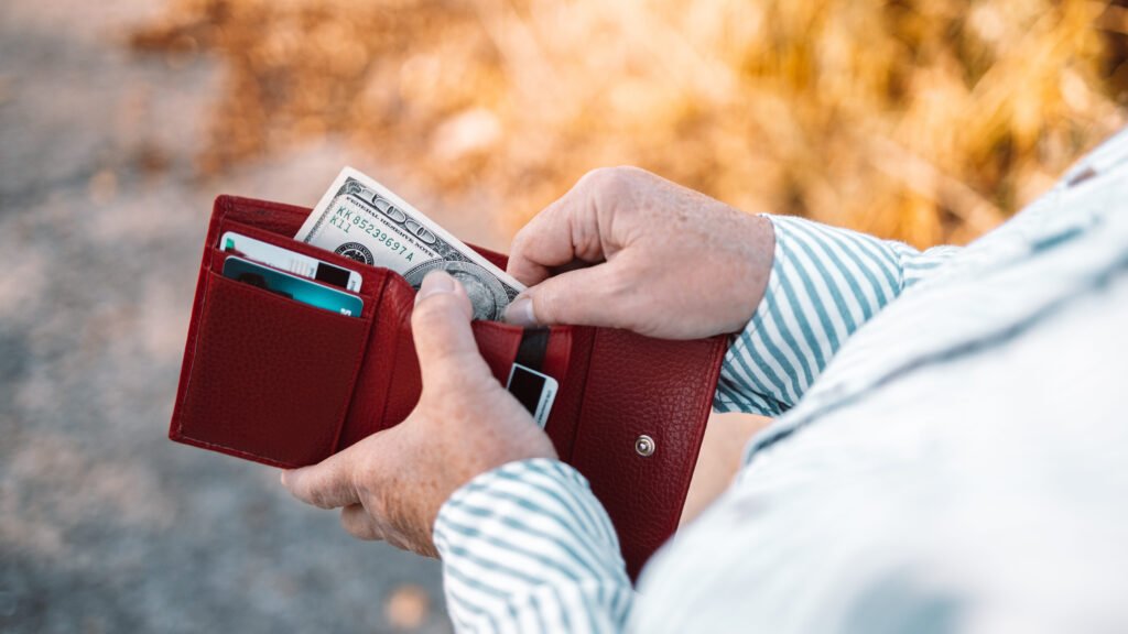 Human_holding_wallet_and_taking_out_money