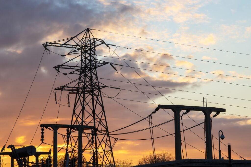 silhouette-of-pylon-and-substation-against-a-warm-2026