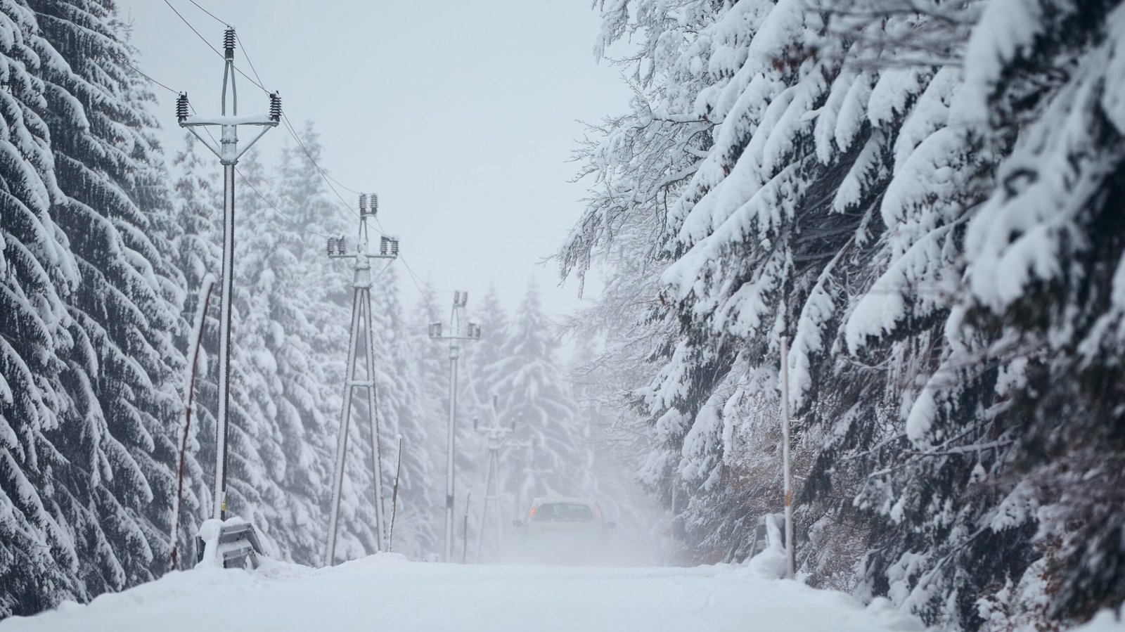 car-driving-on-snow-covered-road-in-the-middle-of-2026