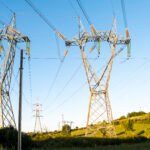 High-voltage transmission lines carrying electricity across the US power grid